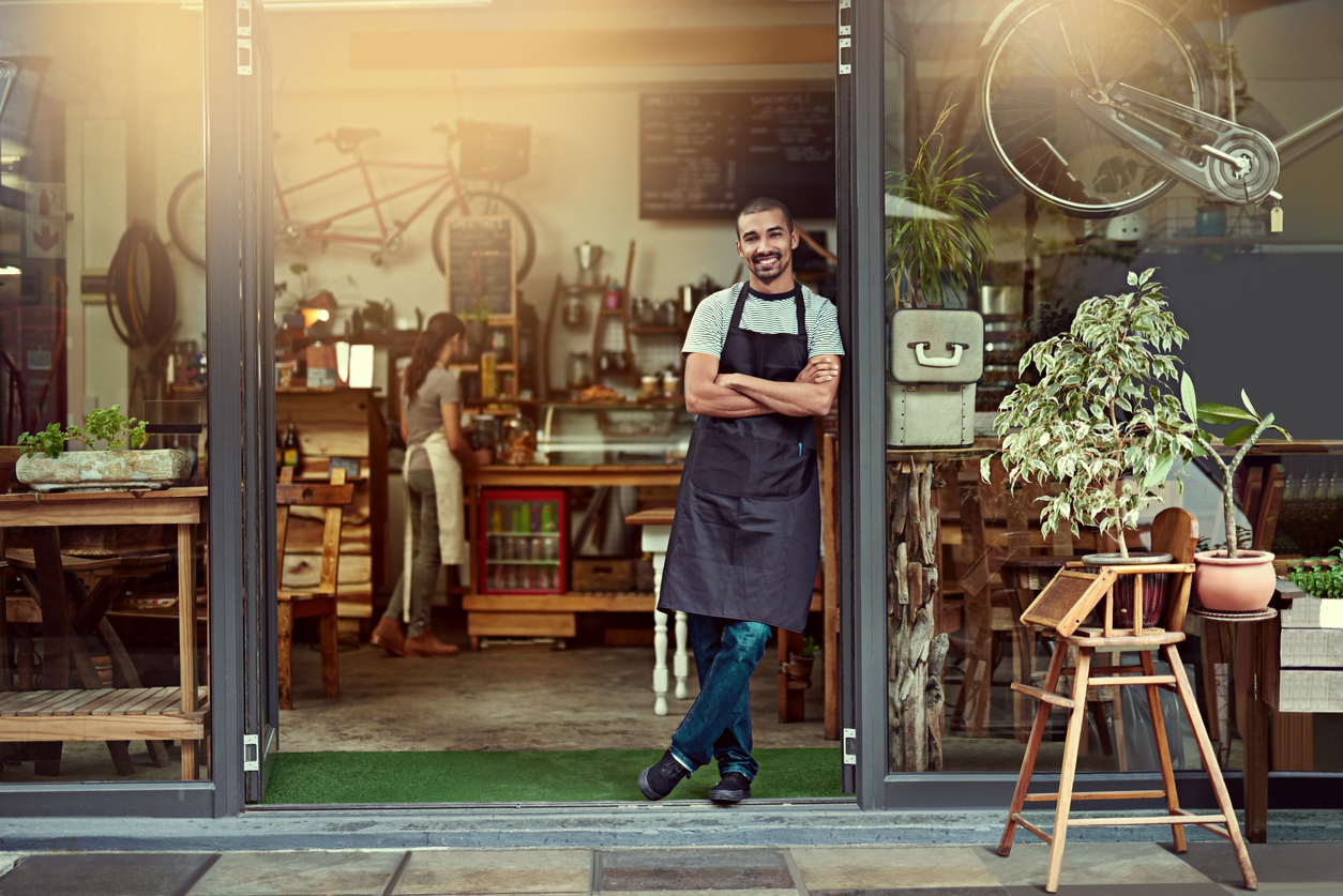 Man standing outside his store